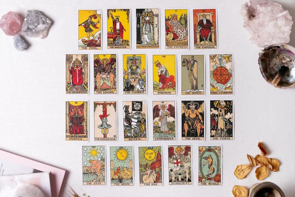 Learn Tarot Online - 20 Flat lay of a complete tarot card spread with crystals and dried flowers, ideal for divination themes.